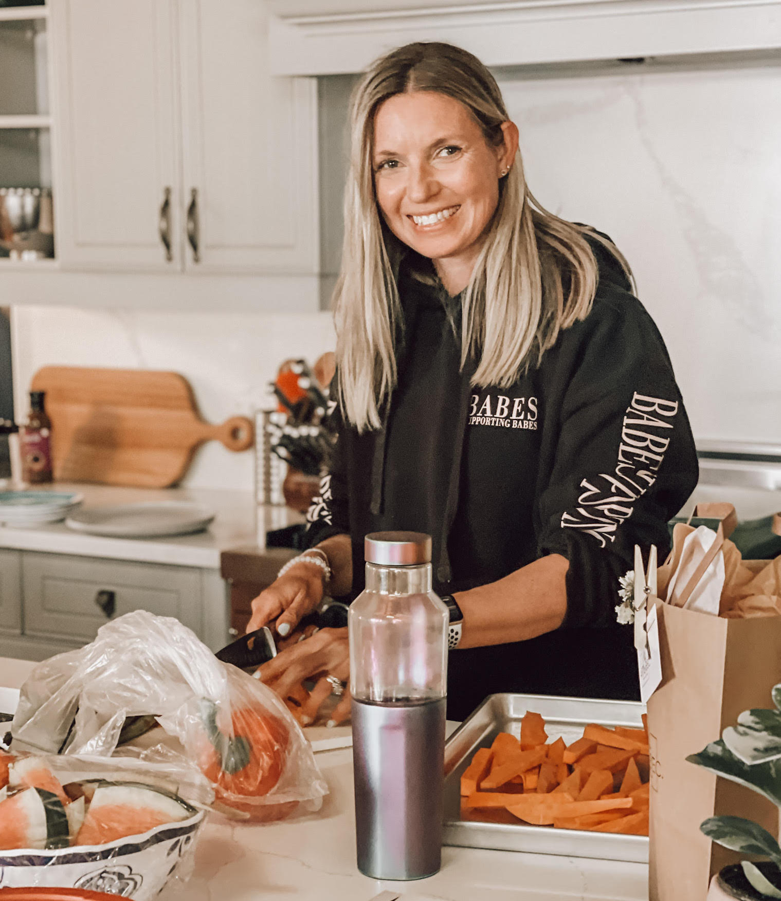 Alyssa chopping vegetables in the kitchen